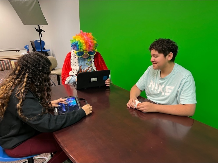 Students using a green screen