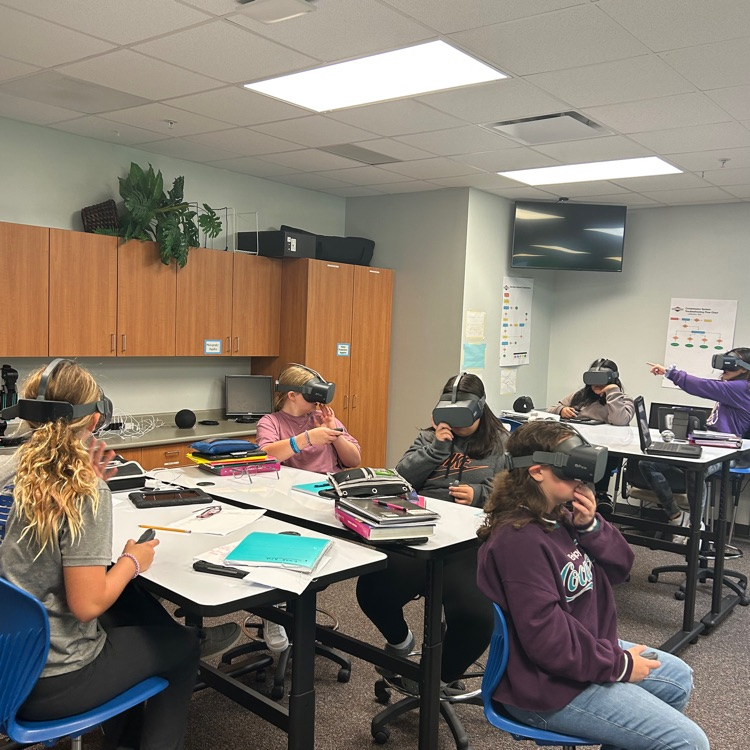 7th Graders enjoying VR.